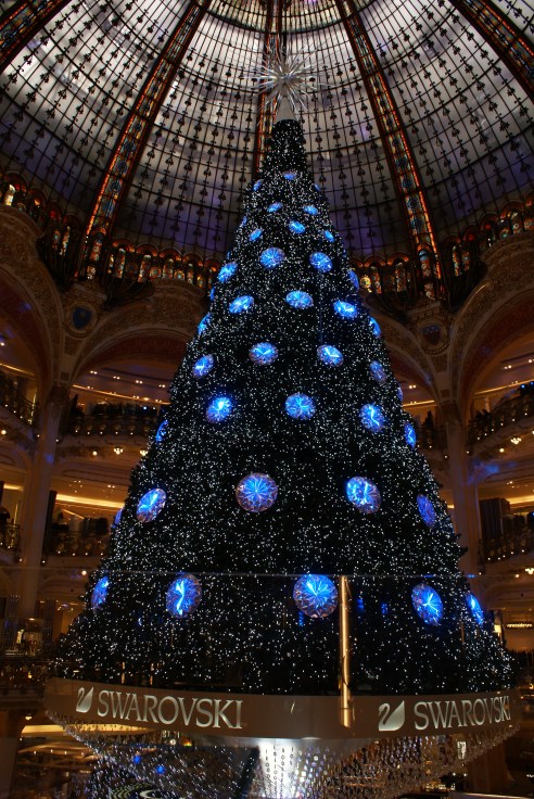 Enormous Christmas tree under "la coupole" in les Galleries Lafayette department store, Paris. Nov 17, 2012.