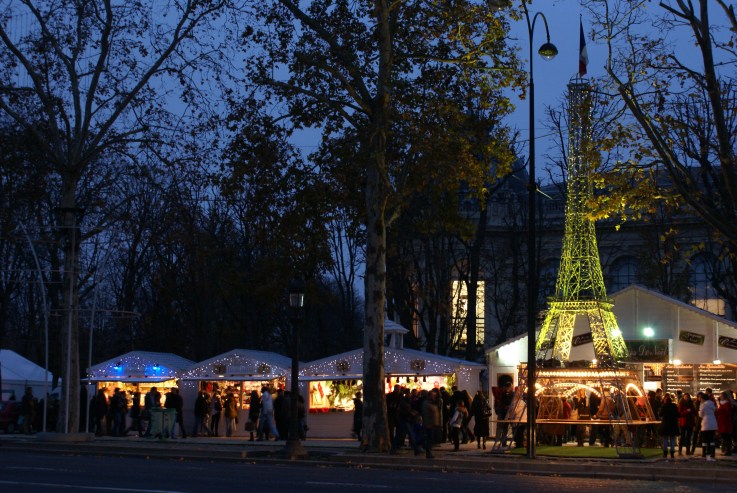 Christmas crafts and food market on the Champs Elysées, complete with Eiffel Tower; Paris. Nov 17, 2012.
