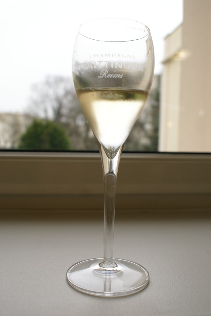 Glass of champagne at Taittinger, Reims, France. Feb 12, 2013.